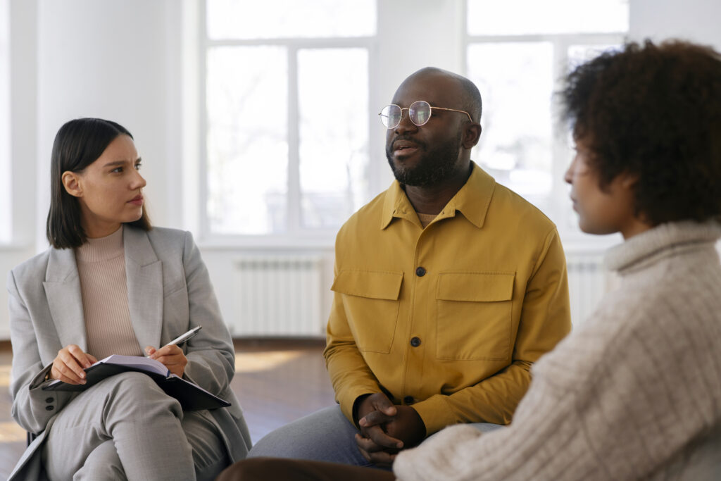 Group discussion in a bright, modern room.